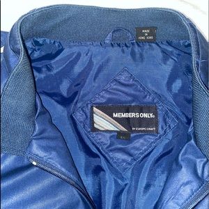 Vintage Blue/Navy Members Only Jacket with the flag. Been worn once maybe twice.